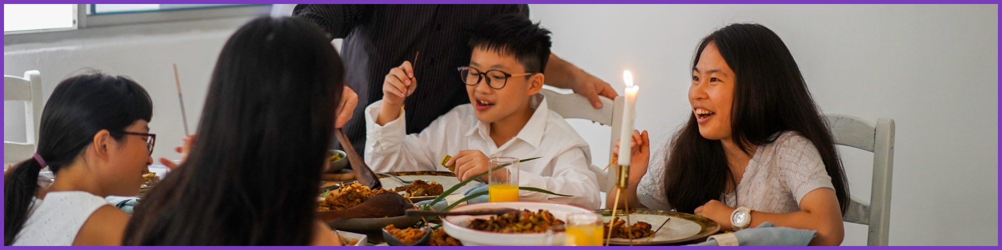 Asian Family eating dinner together