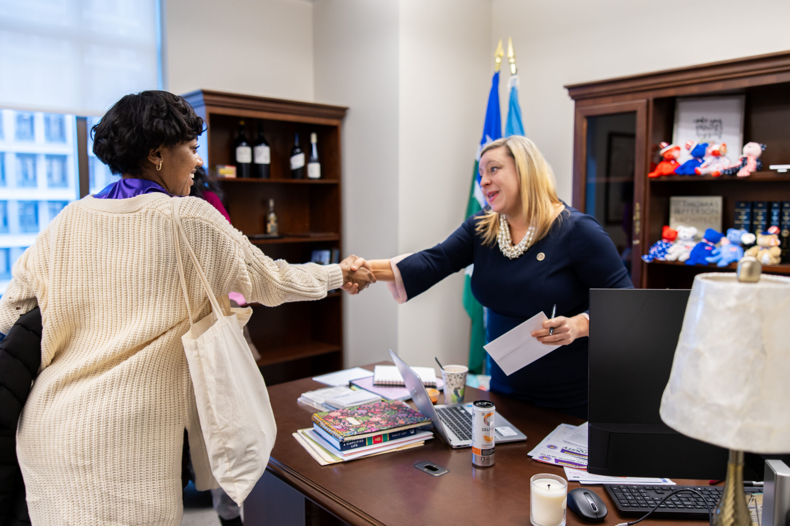 Senator Jordan shaking hands with youth advocate